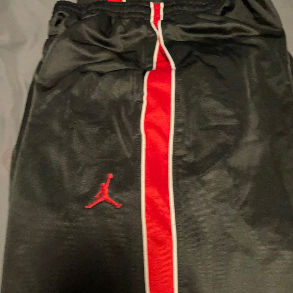 Black and red Jordan pants